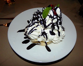 Two Chefs - Meringue Swiss Ice cream, chocolate sauce, bananas, cream & meringue.