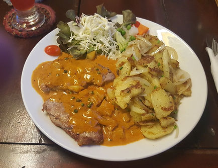 Pork steaks in green pepper sauce with fried potatoes 250baht